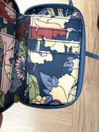inside with zipper and card slots on Sakroots Floral Crossbody Phone Wallet 