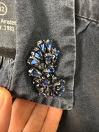 jewel detail on Sandwich Denim Studio Amsterdam charcoal 100% Tencel shirt with stunning hand-applied blue crystal collar embellishment and ruffle cuff detail at Blue Sparrow Shop