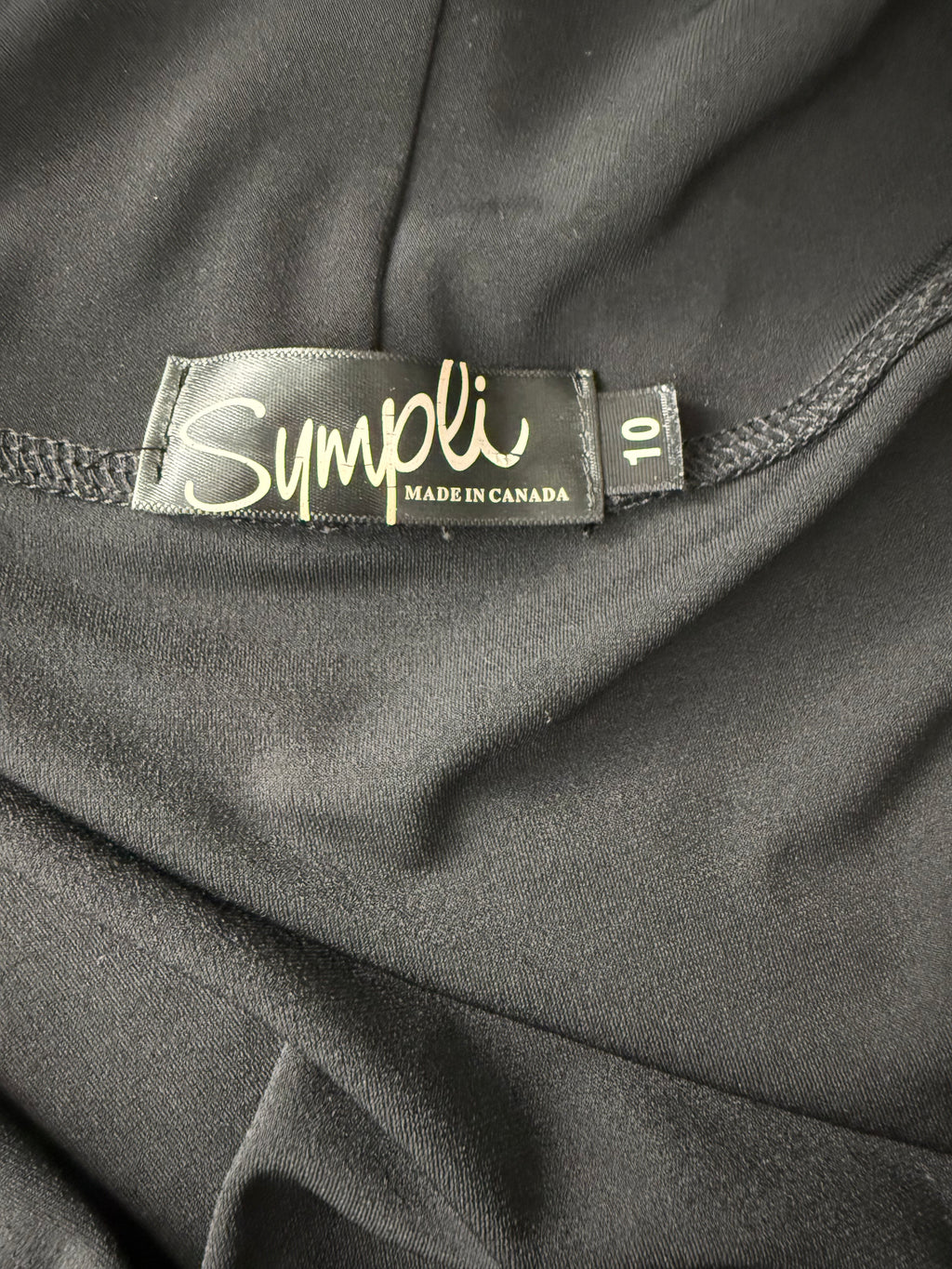 label inside Sympli Waterfall Front Open Jacket Made in Canada