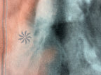 logo on back of Athleta tie dye  Sports Bra Crop Top
