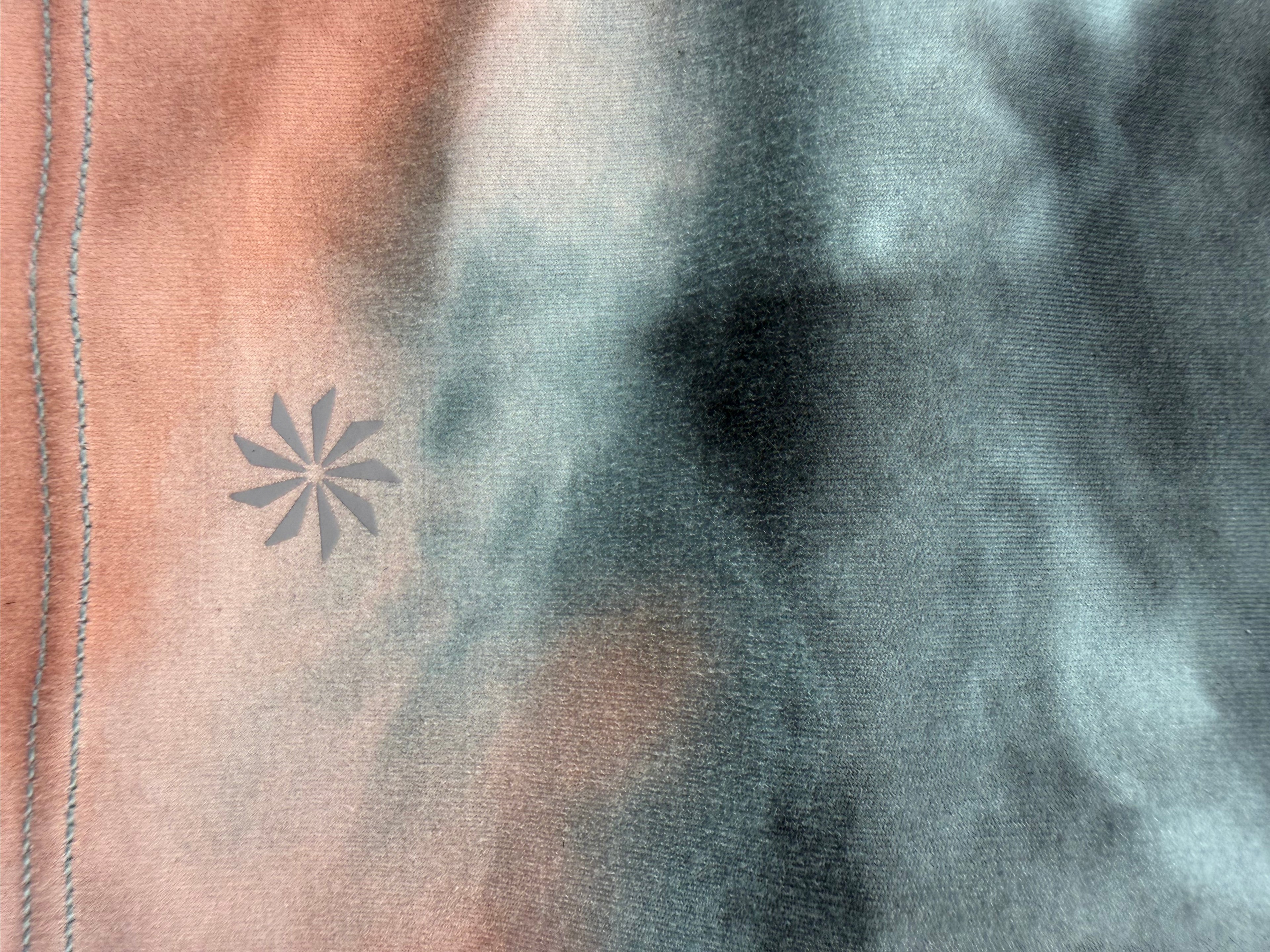 logo on back of Athleta tie dye  Sports Bra Crop Top