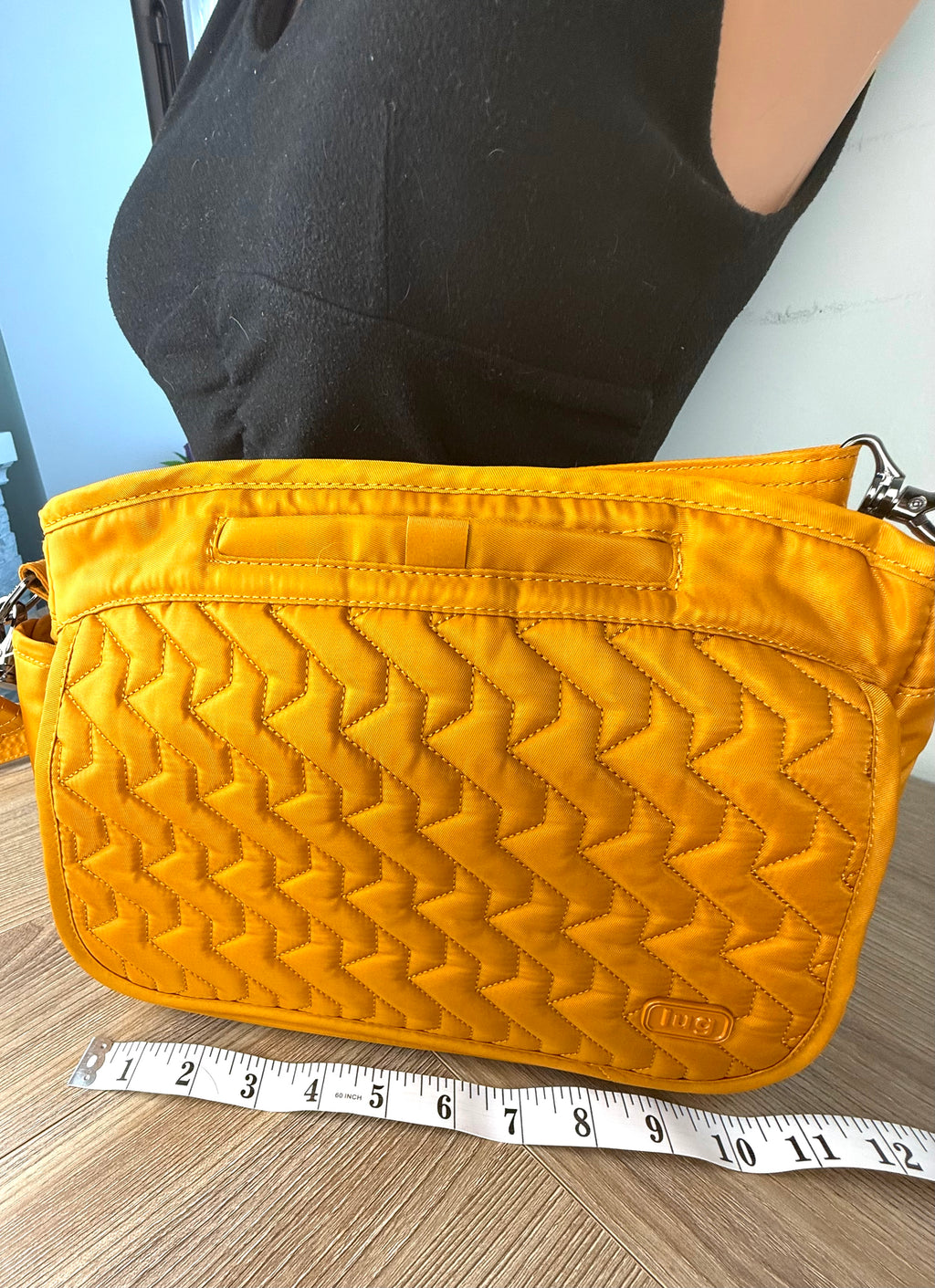 lug travel cross body bag measuring approx 11 inches 