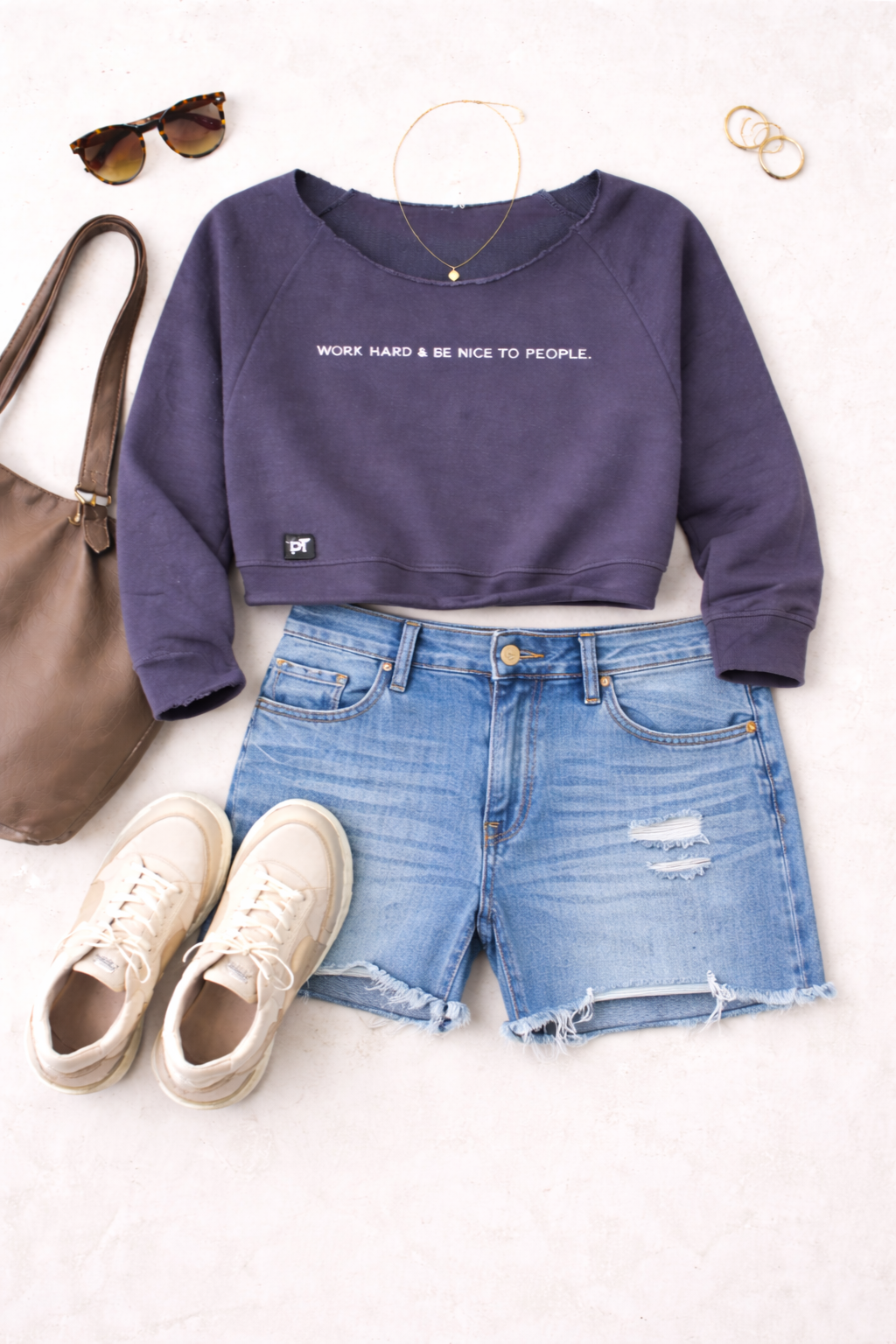 Cropped Graphic Sweatshirt | Size XS at Blue Sparrow Shop - Work Hard Be Nice to People Sweatshirt on flatlay with shorts and shoes and bag