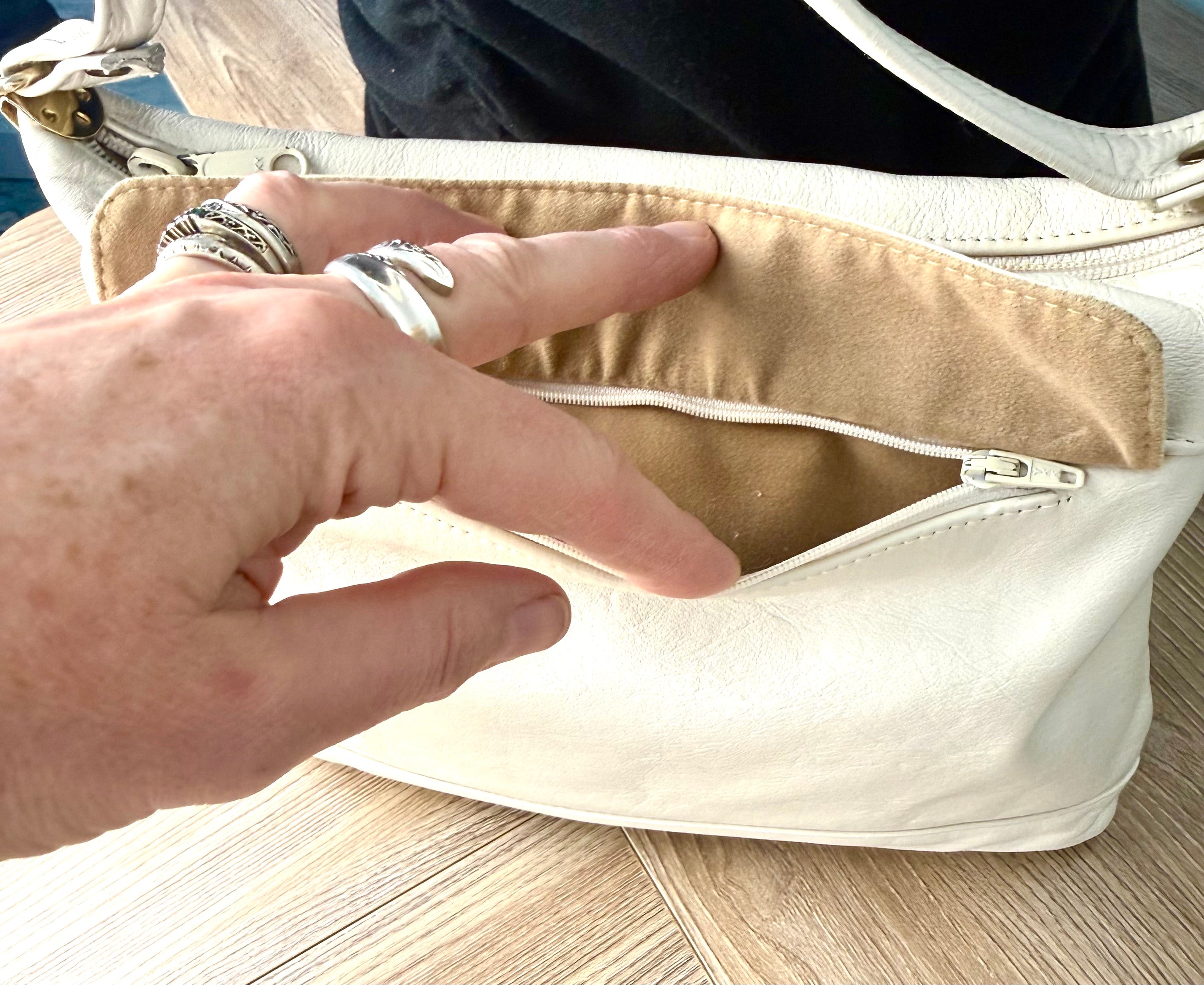 outside zipper flap section on Brixton leather vintage bag 