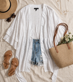 oversized white eyelet kimono at Blue Sparrow Shop flatlay with sandals and bag 