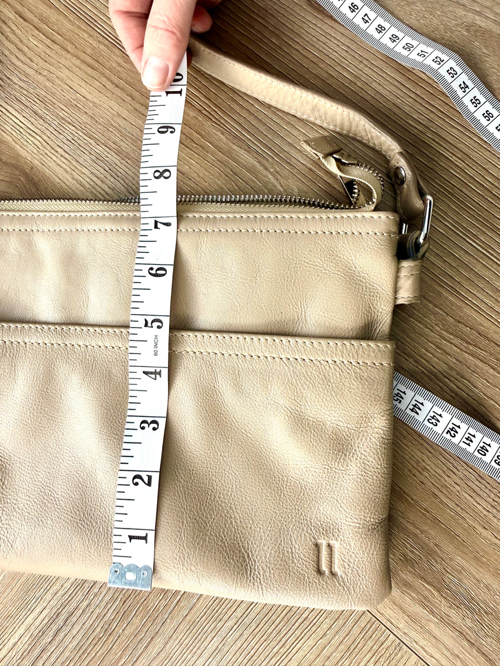 pelle-rfid-leather-crossbody-bag measures 7" deep