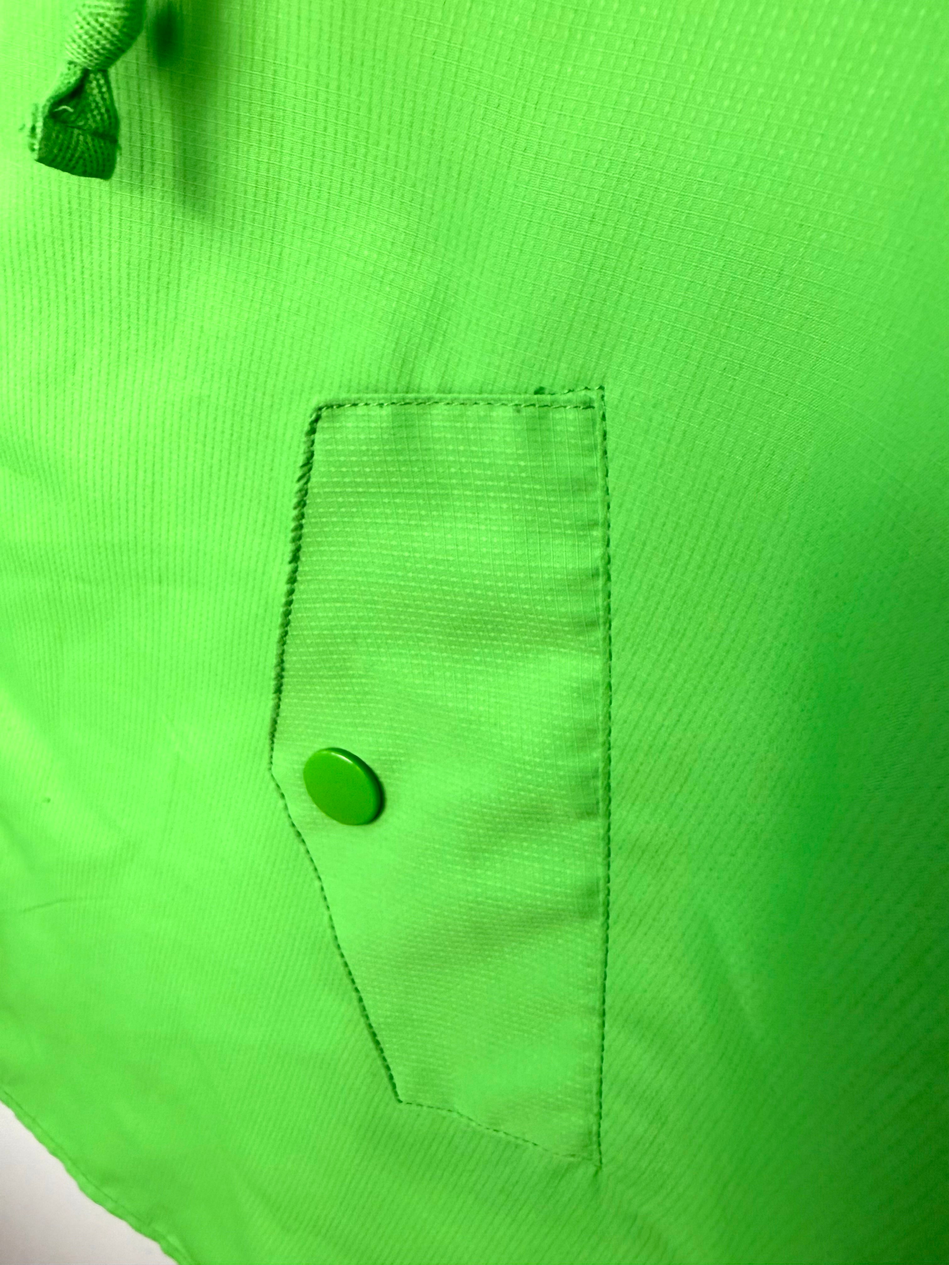 pocket detail on lime green spring poncho for women 