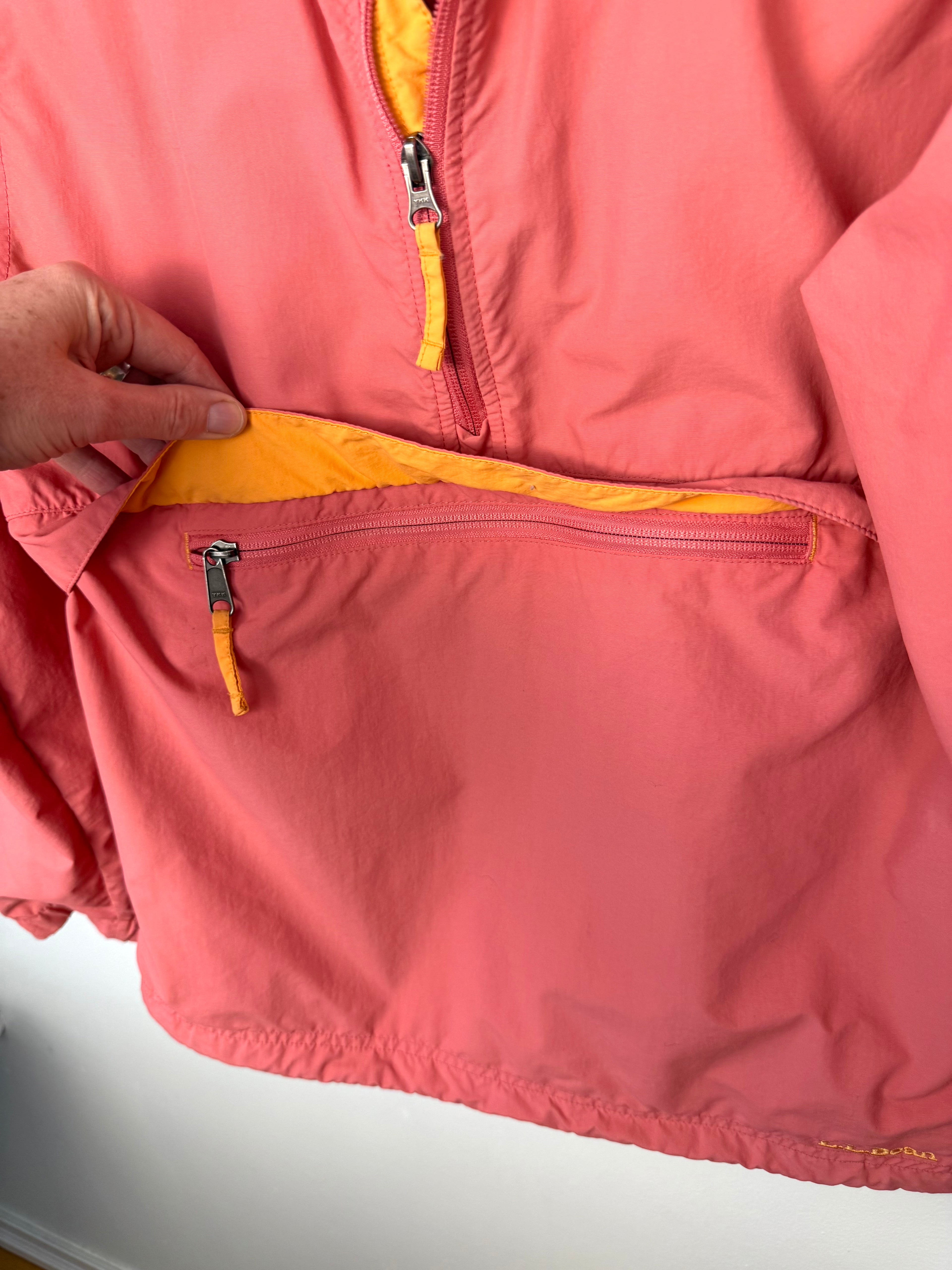 pouch on the front of LL Bean anorak jacket in coral and orange 