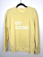 front view Cotopaxi pastel yellow crewneck sweatshirt with white “DO GOOD.” graphic.