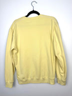 preloved Cotopaxi pastel yellow crewneck sweatshirt with white “DO GOOD.” graphic. back view 