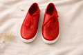 red sequinned sneakers on a cloth at Blue Sparrow Shop - size 9