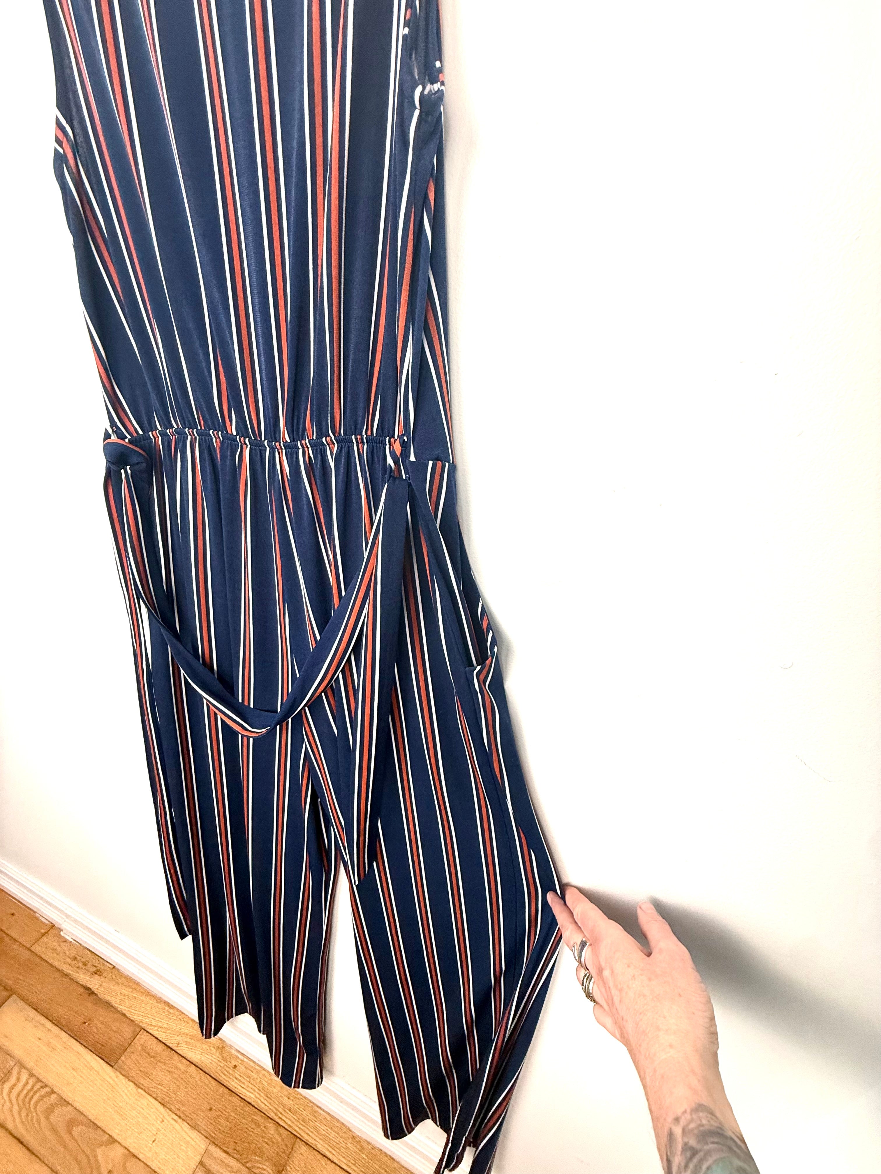 removable belt shown on back of NWT Wide leg hem detail navy striped jumpsuit women.