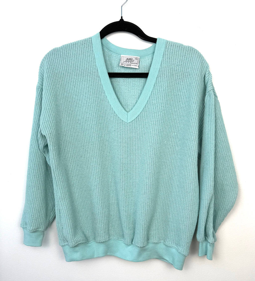 retro 80's style waffle knit sweater on hanger 