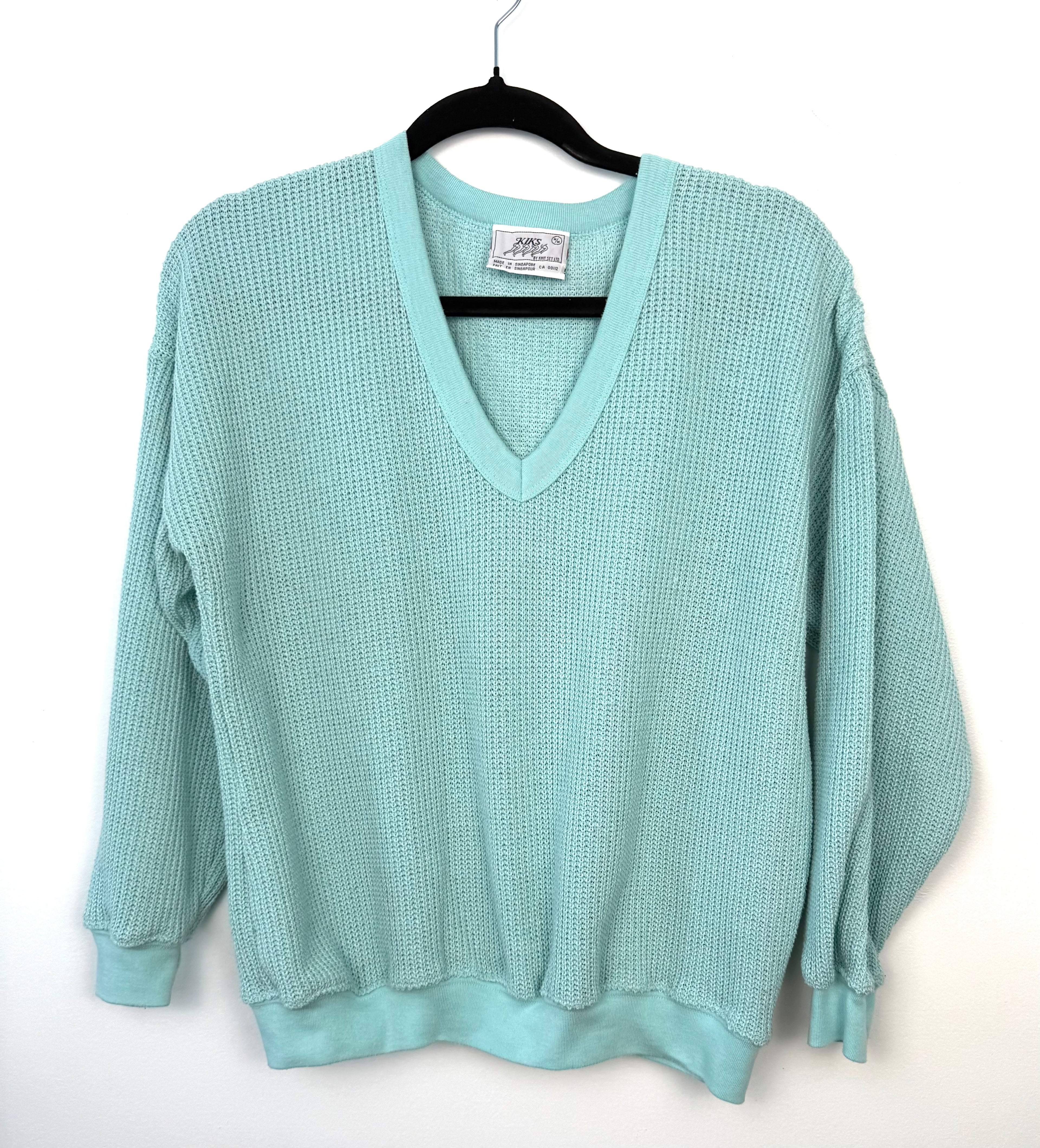 retro 80's style waffle knit sweater on hanger 