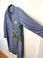 side view of NWOT 100% Tencel Tilley Handpainted Denim Jacket | Size XXL on hanger