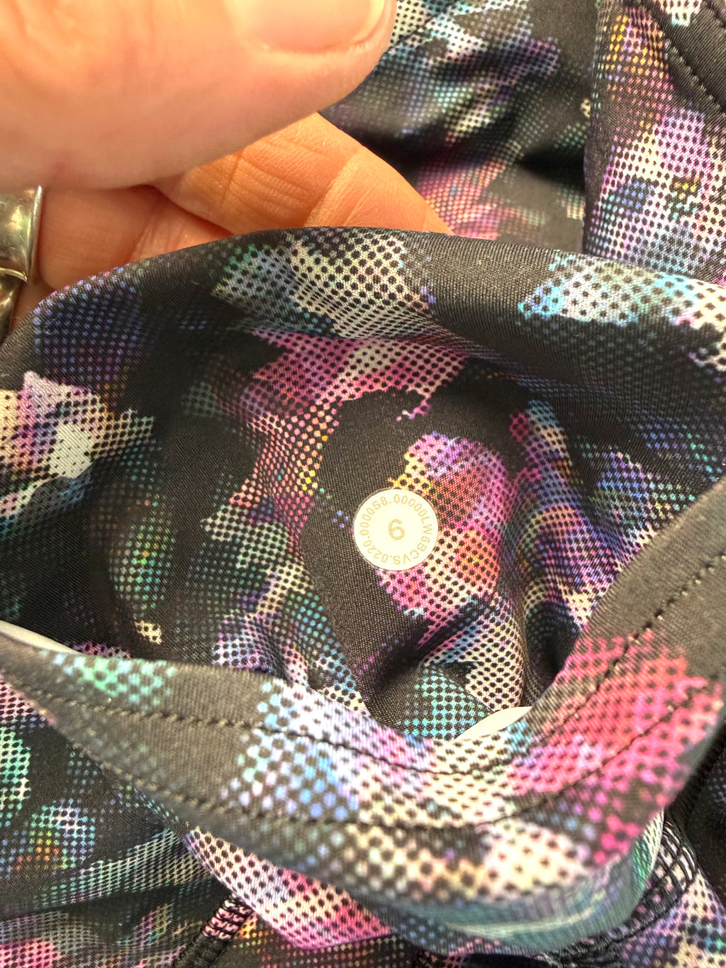 size tag inside back pocket of Lululemon floral capris | Size 6 at Blue Sparrow Shop 