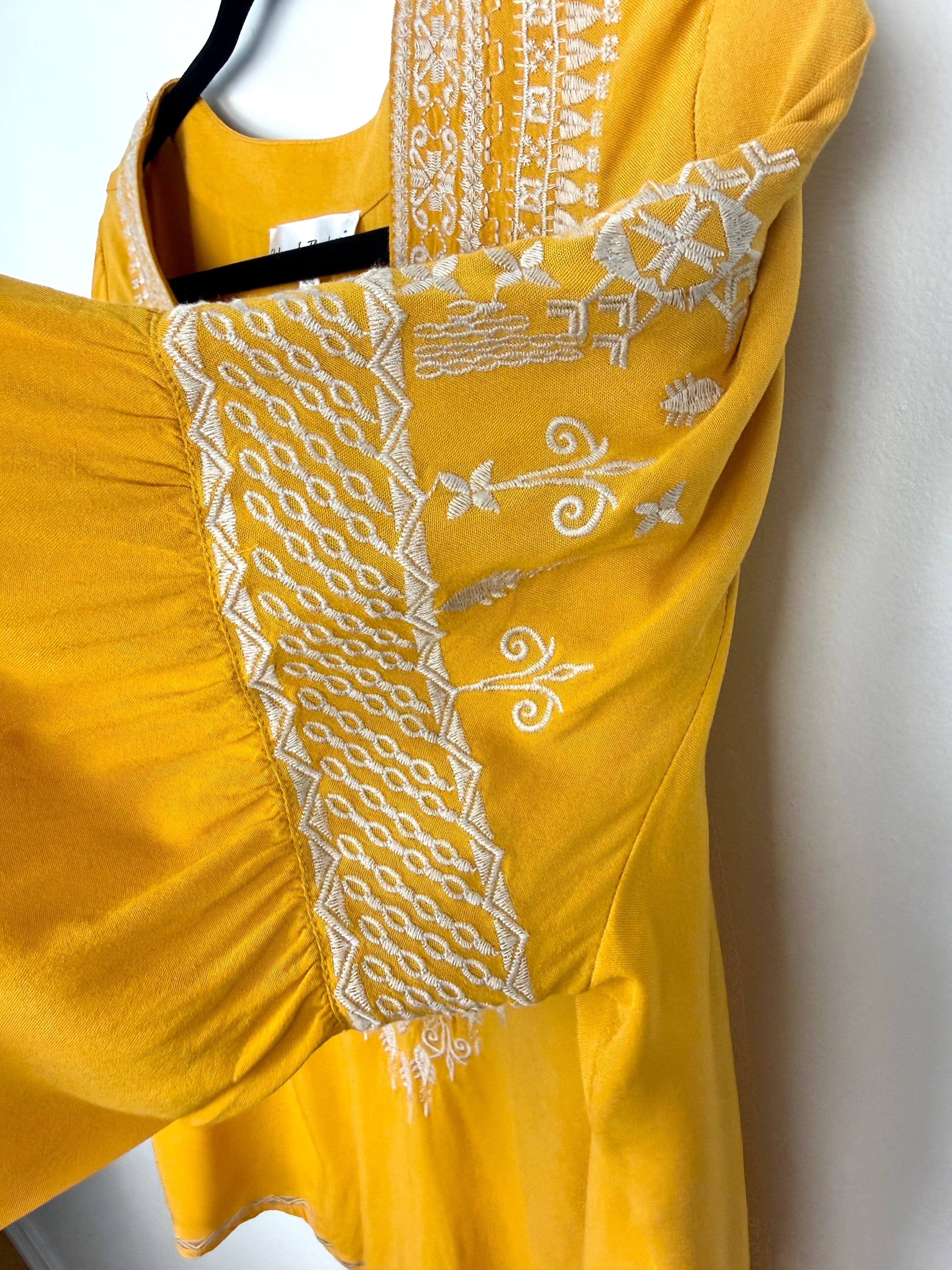 sleeve detail on Chelsea & Theodore Embroidered Boho Blouse 