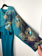 sleeve on Teal Peacock Print 2-Piece Knit Set — Wide-Leg Pants + Draped Top, Size XL at Blue Sparrow Shop
