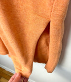 slit at hem of Marble UK brand knit kimono shawl or lightweight cardigan in peach 