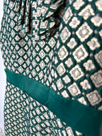 textured brocade cocktail dress with defined waist band