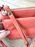 top of Coral Coloured HOBO International Leather Crossbody Wristlet Bag 