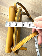 top of Vegan Leather Accessorize Mustard Yellow Crossbody Bag -measuring approx 2" thick 