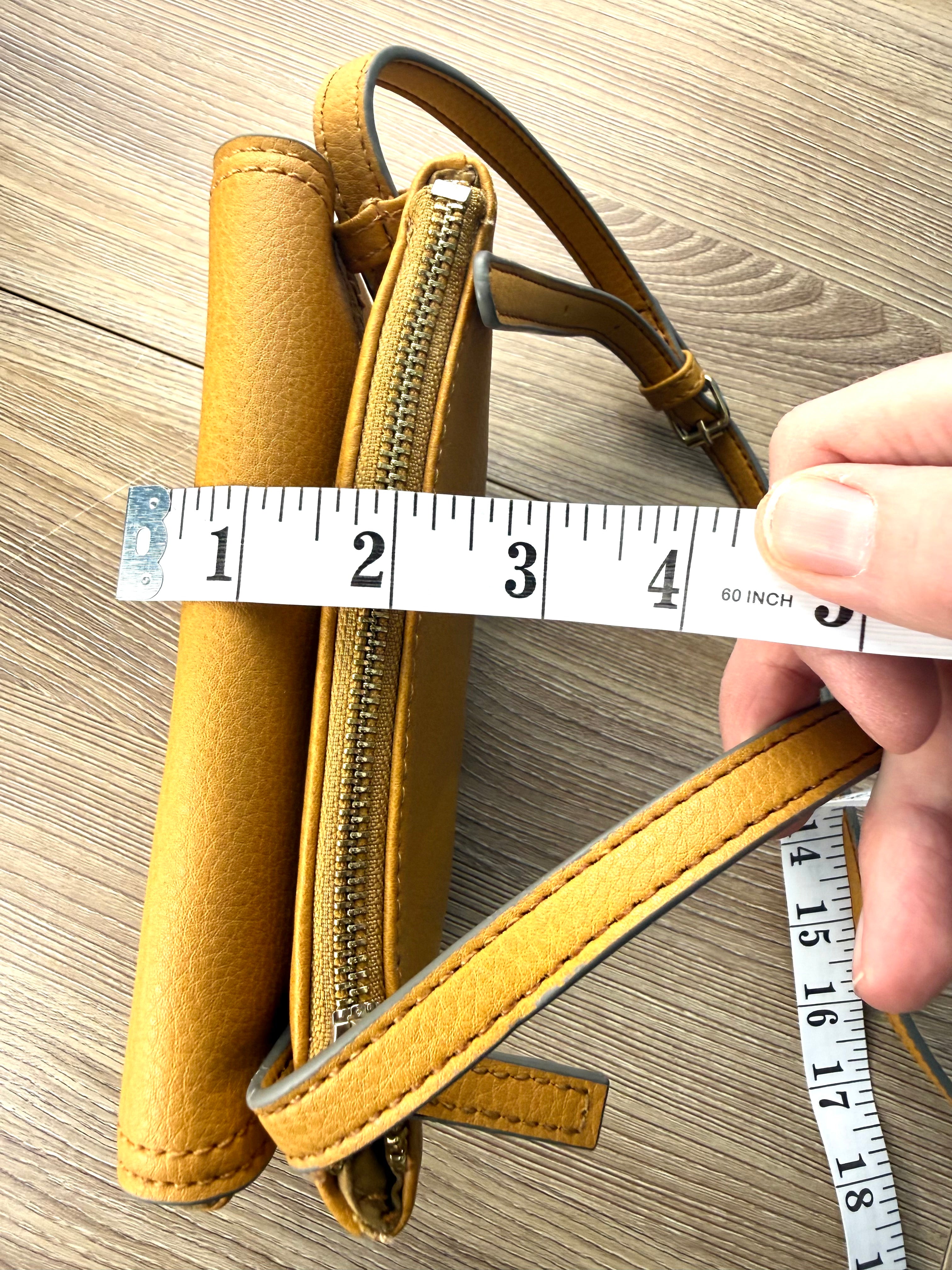top of Vegan Leather Accessorize Mustard Yellow Crossbody Bag -measuring approx 2" thick 
