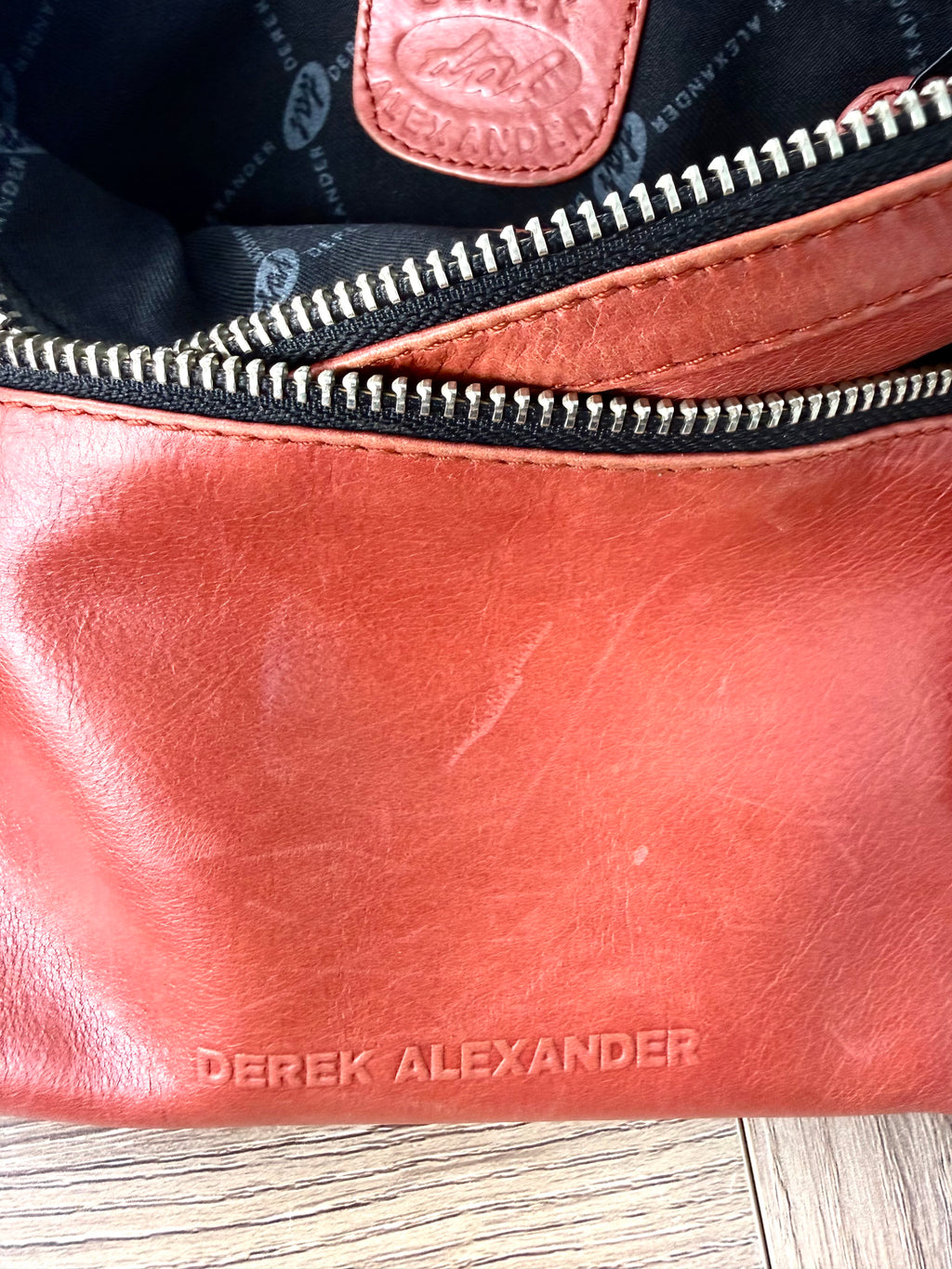 top zips and inside of Derek Alexander Leather Crossbody Bag  