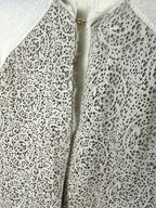 twin set simona barbieri beige cardigan with laser cut leather front panel up close detail of leather