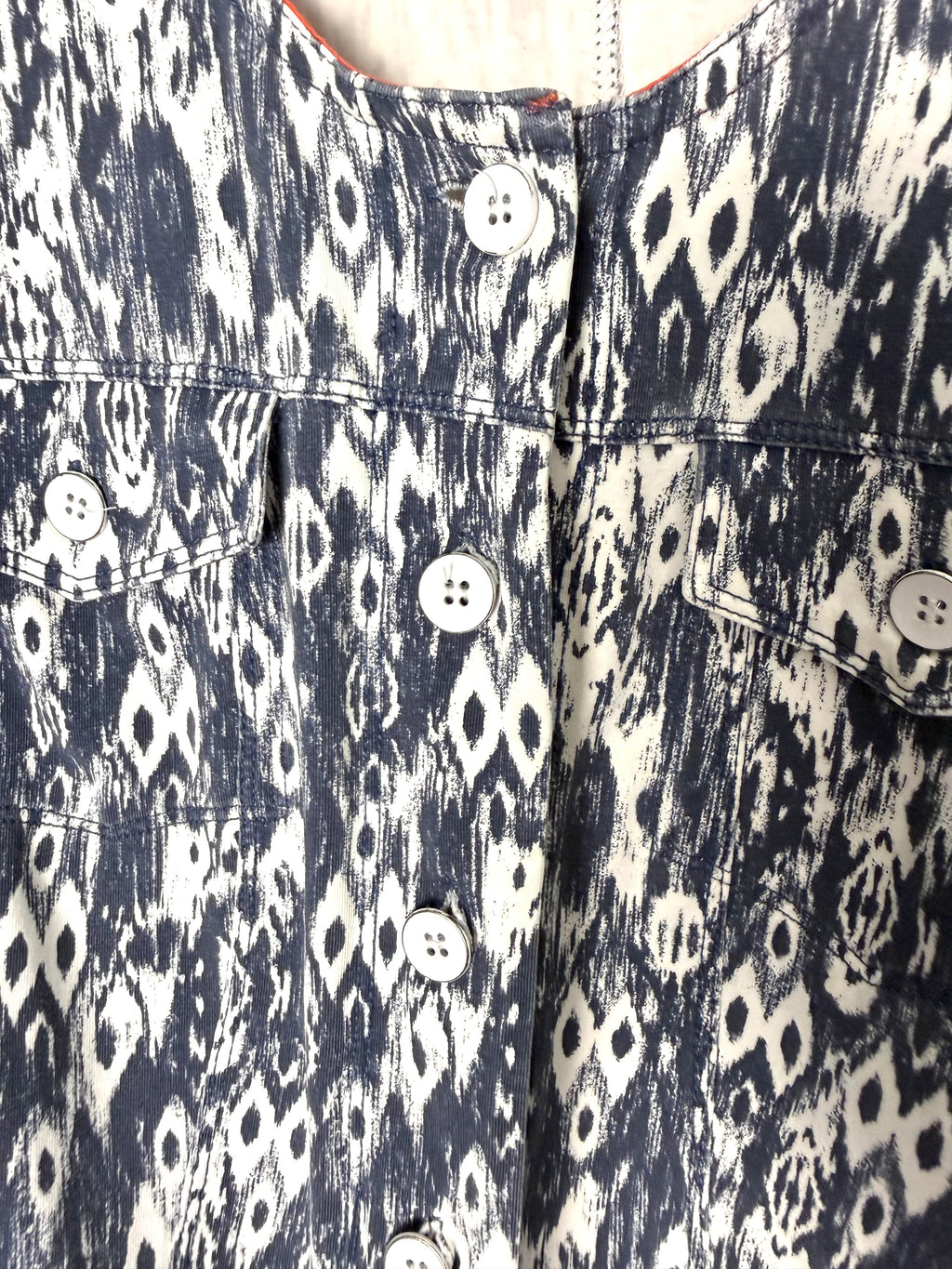 up close of button front Sandwich brand jacket in denim blue and white 