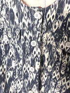 up close of button front Sandwich brand jacket in denim blue and white 