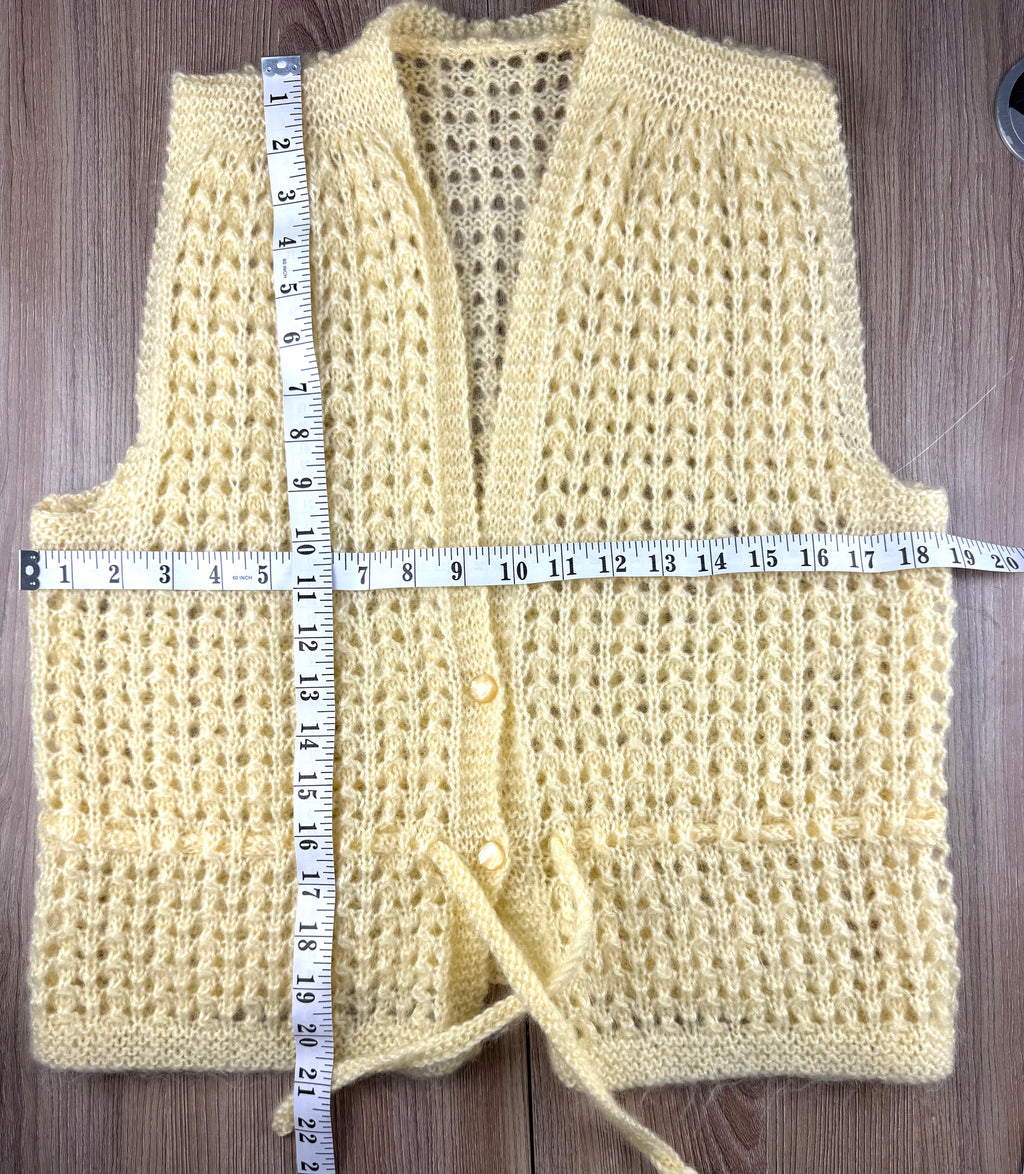 vintage handmade vest measuring 21" shoulder to hem and 38" bust 