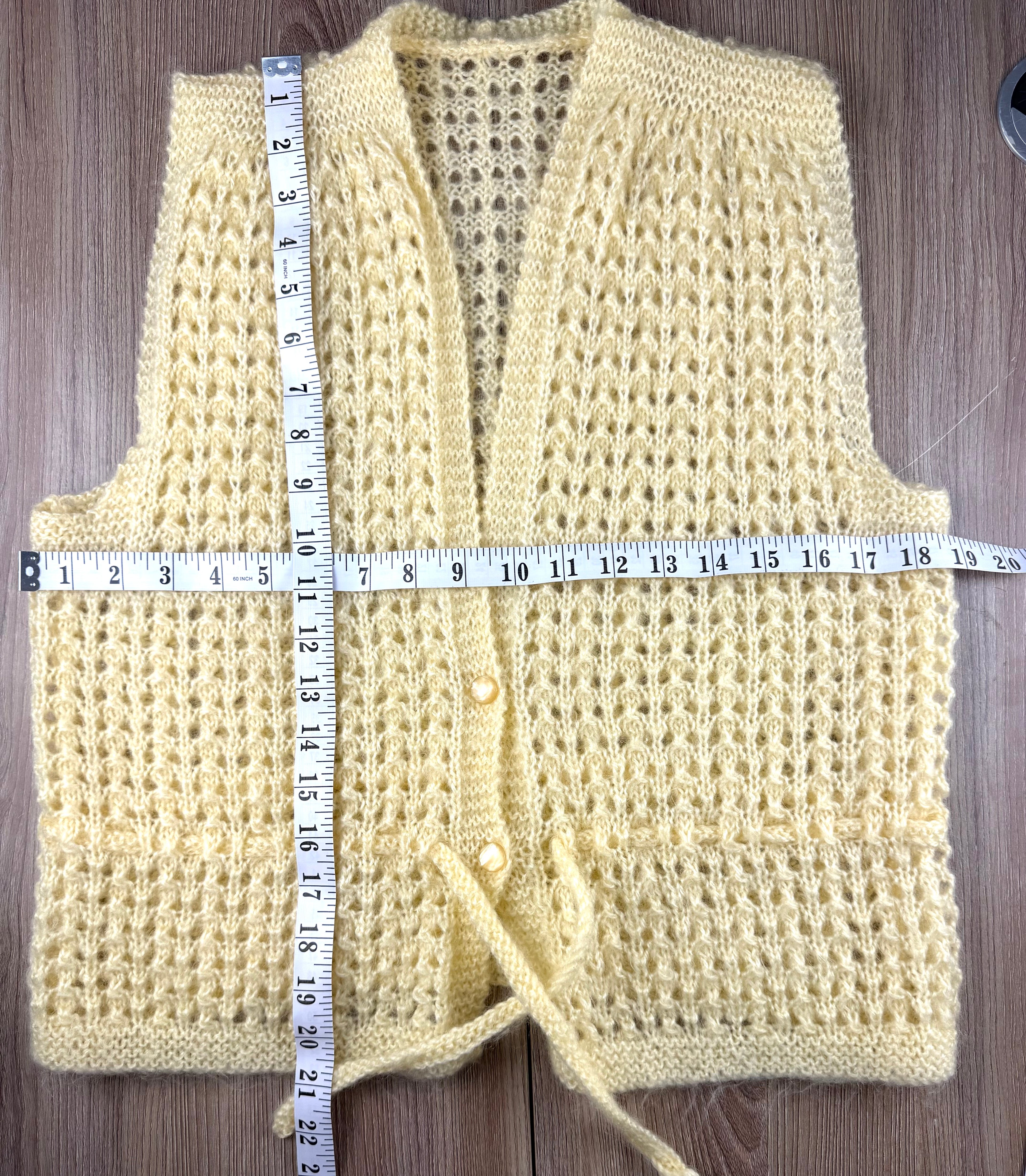 vintage handmade vest measuring 21" shoulder to hem and 38" bust 