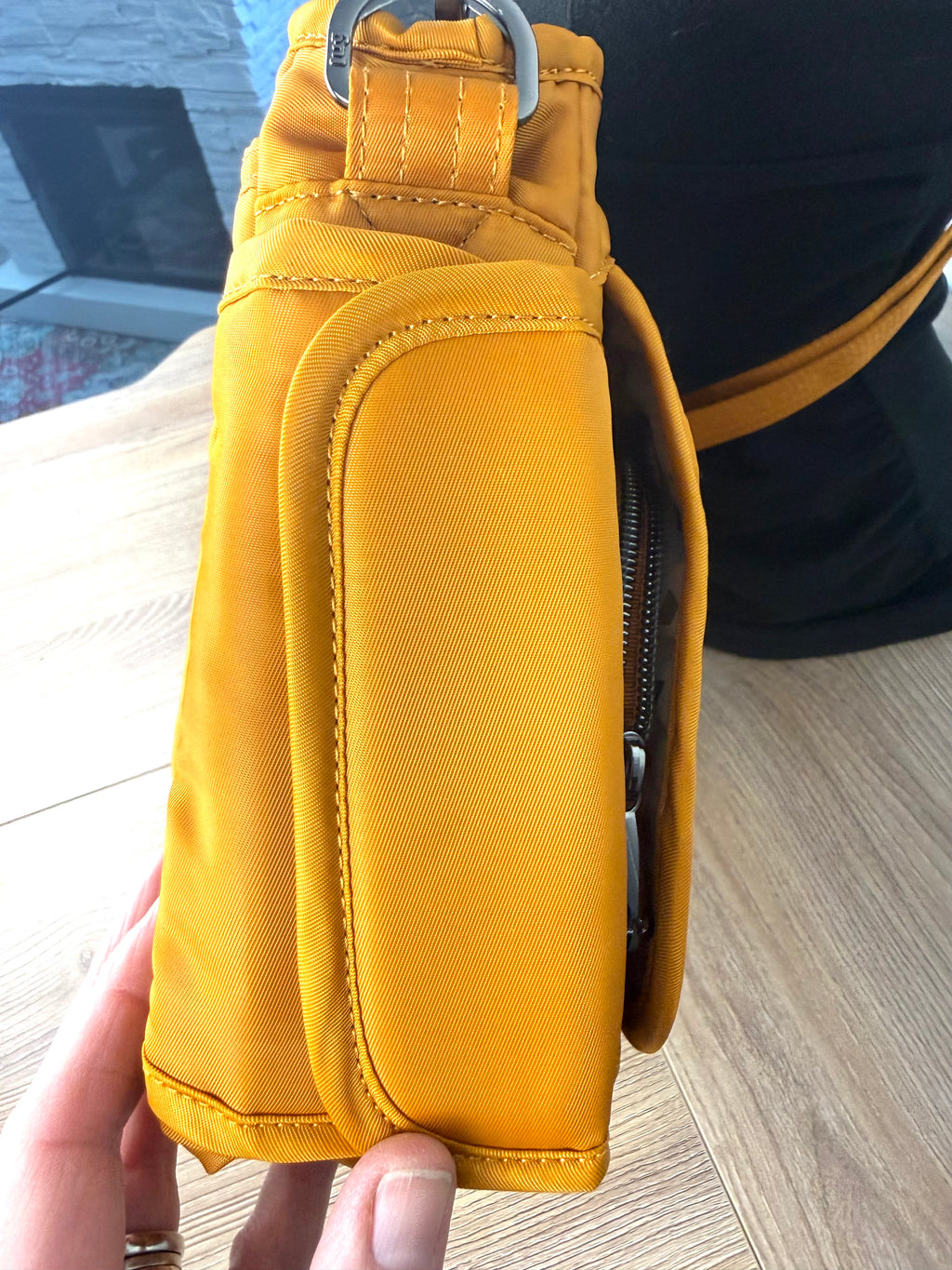 water bottle holder on the side of  front of Lug Wings Travel Cross Body Bag 