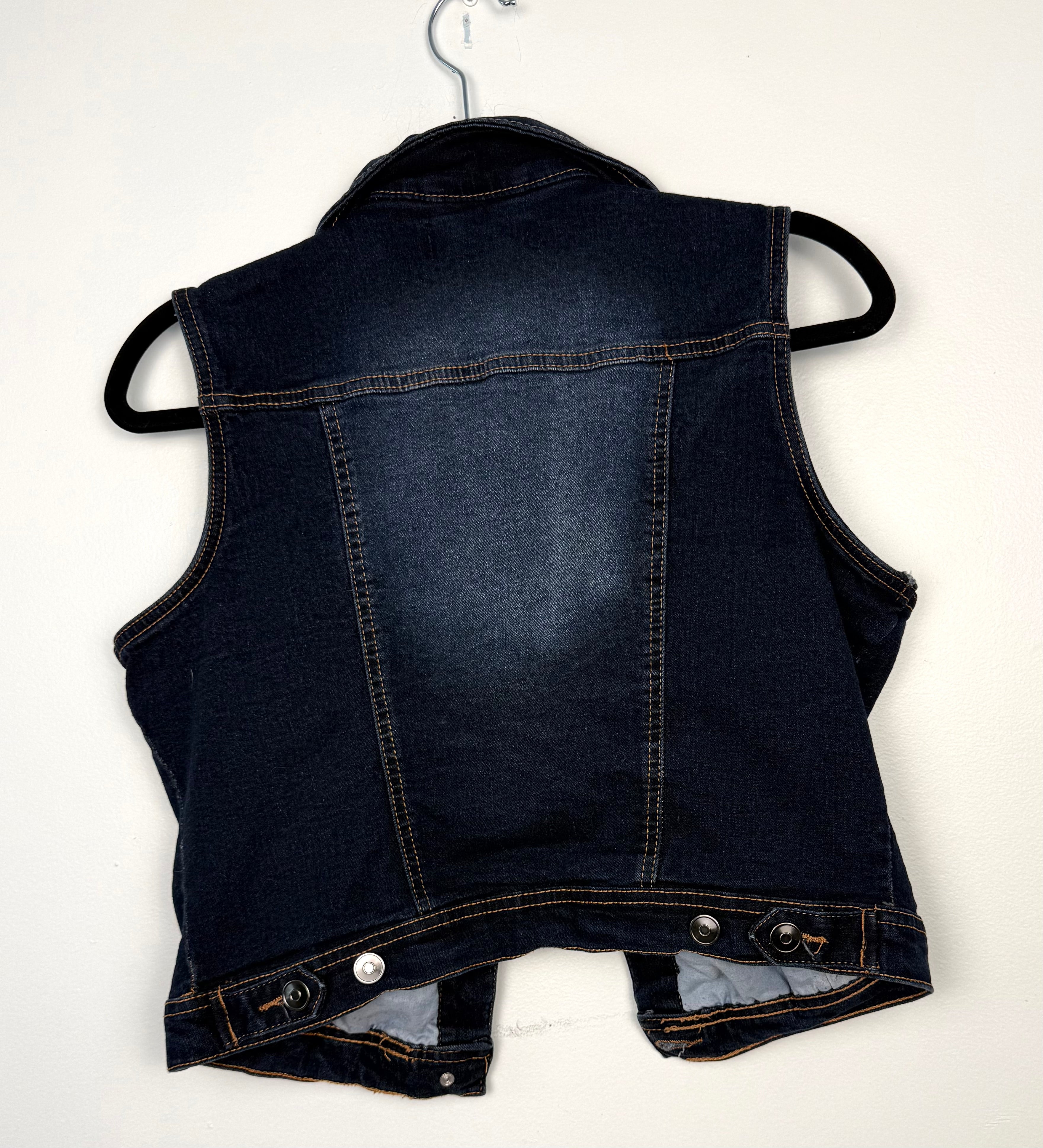 y2K distressed denim vest for women  back view on hanger
