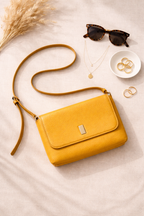Yellow vegan leather cross body bag at Blue Sparrow Shop Canada Resale lifestyle photo 